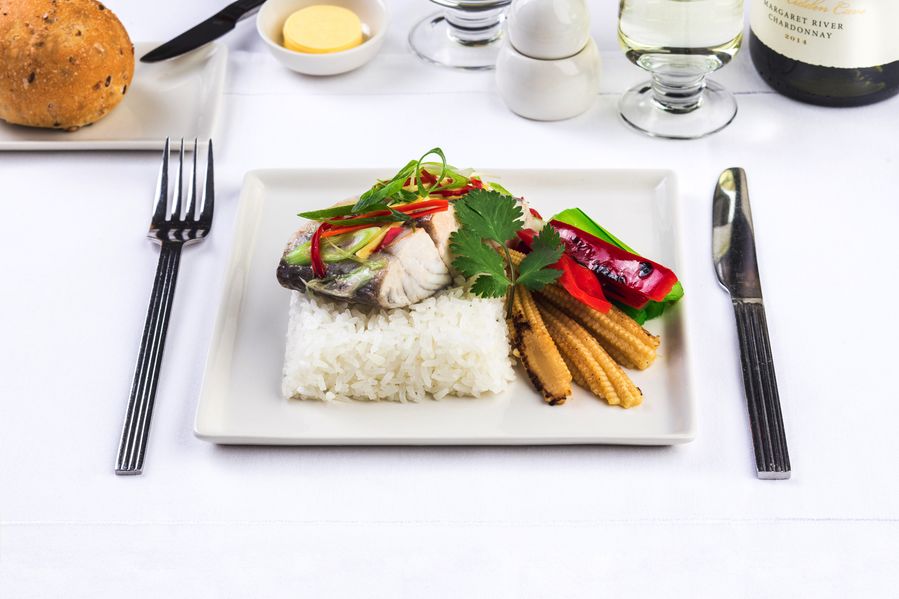 Chilli and ginger barramundi: Australian Barramundi infused with fresh ginger and mild red chilli, lightly simmered and fnished with a hot sesame dressing. Accompanied by wok-seared young vegetables and steamed jasmine rice.